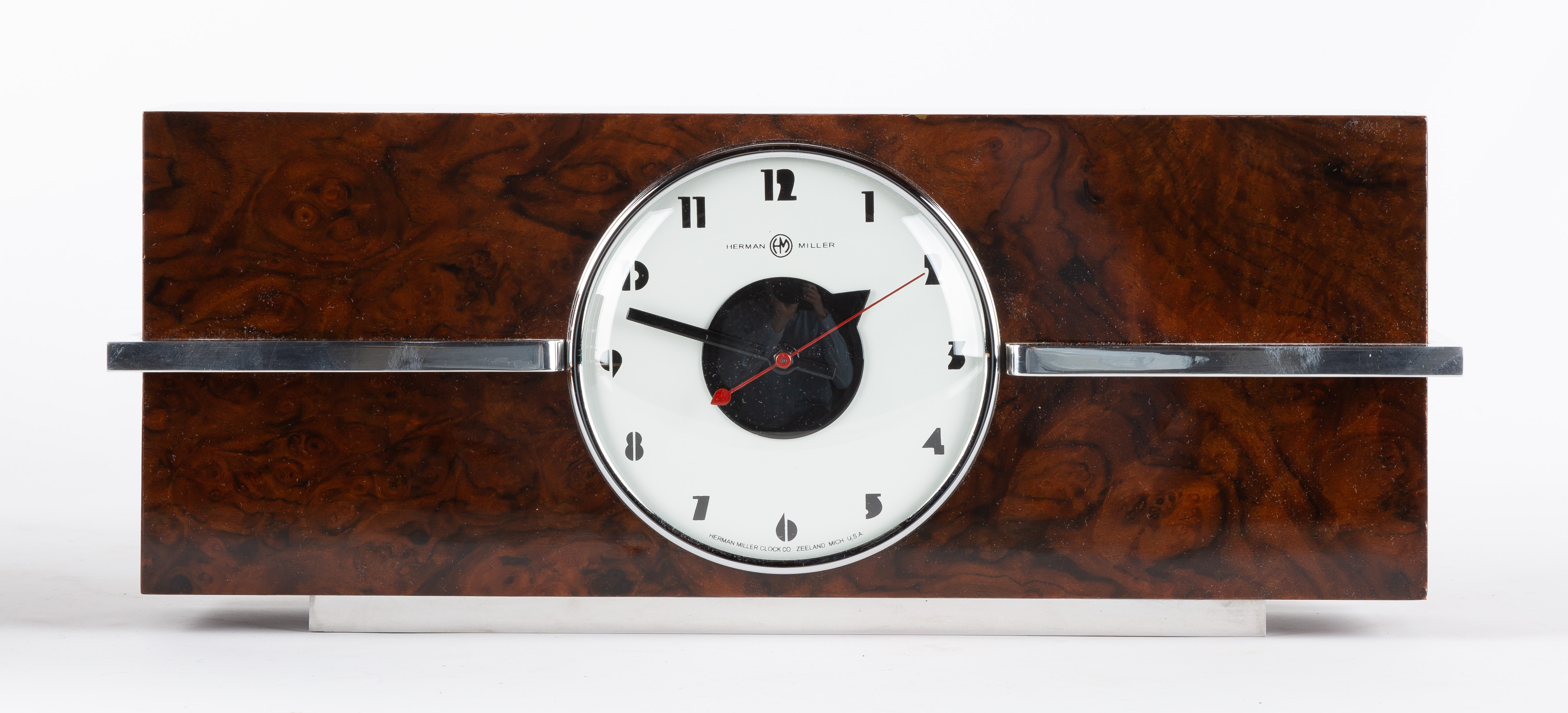 Appraisal: GILBERT ROHDE STYLE CLOCK Rosewood veneer and chrome plated