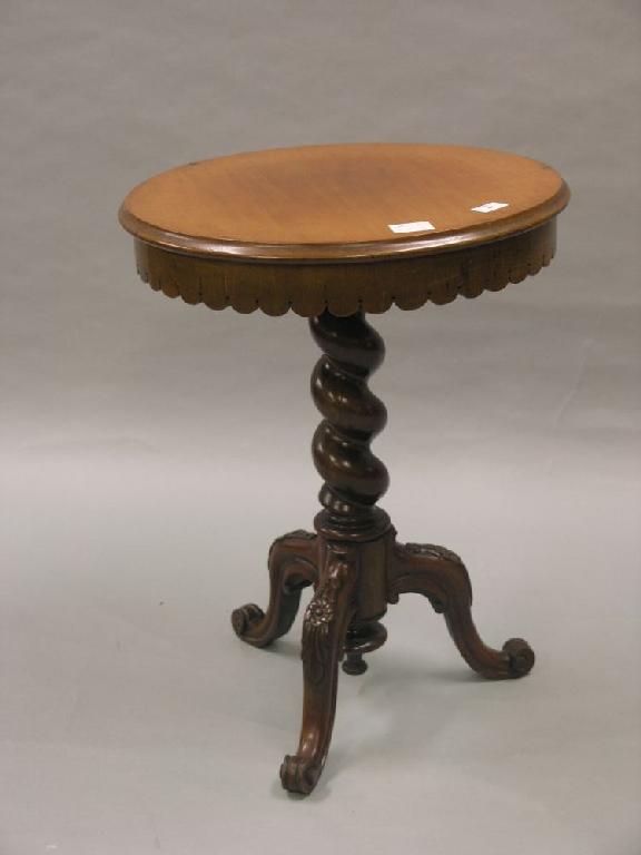 Appraisal: A Victorian mahogany tripod table circular top with shaped frieze