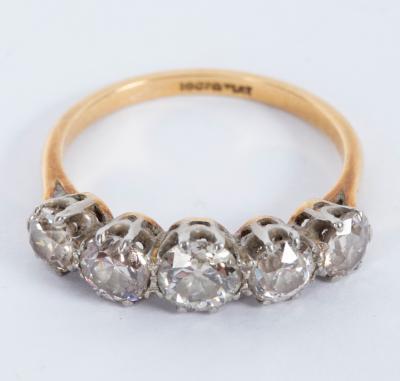 Appraisal: A diamond five-stone ring in a scroll setting set in