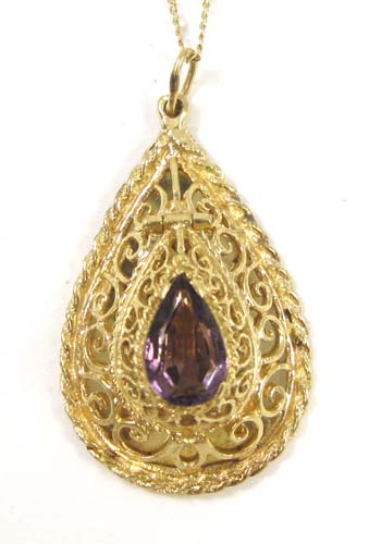 Appraisal: FOURTEEN KARAT GOLD PENDANT NECKLACE The yellow gold filigree-design locket