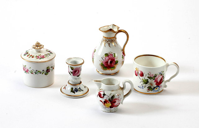 Appraisal: AN ENGLISH PORCELAIN MINIATURE MUG decorated with flowers and with