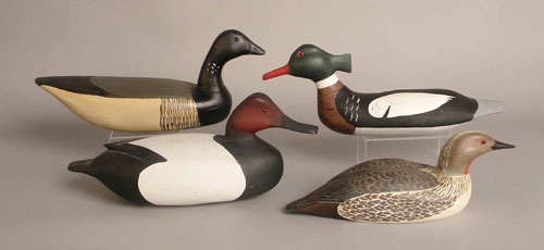 Appraisal: Four duck decoys th c to include an unsigned Merganser