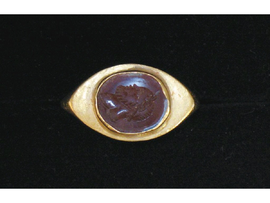 Appraisal: A LARGE HEAVY GAUGE ROMAN GOLD RING with a Cornelian