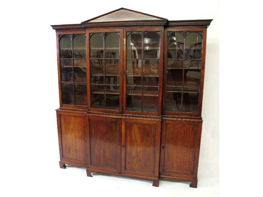 Appraisal: A th century mahogany breakfront bookcase the dentil cornice with