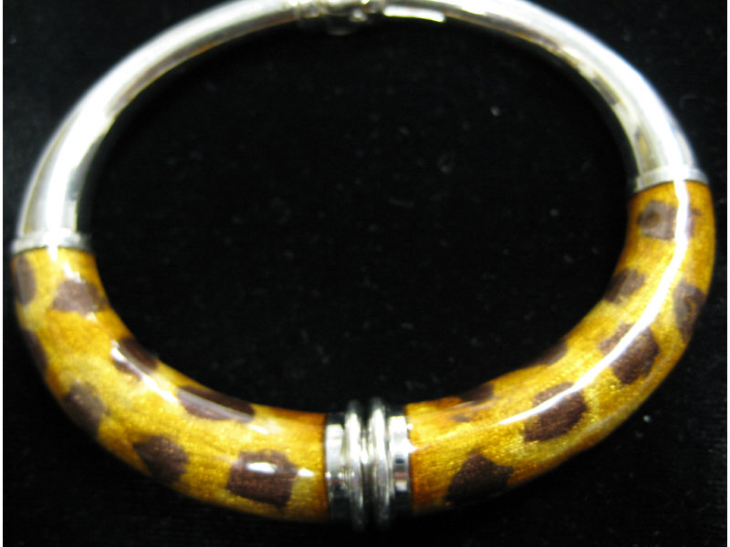 Appraisal: SILVER AND ENAMEL BRACELET Silver bangle with enamel leopard pattern