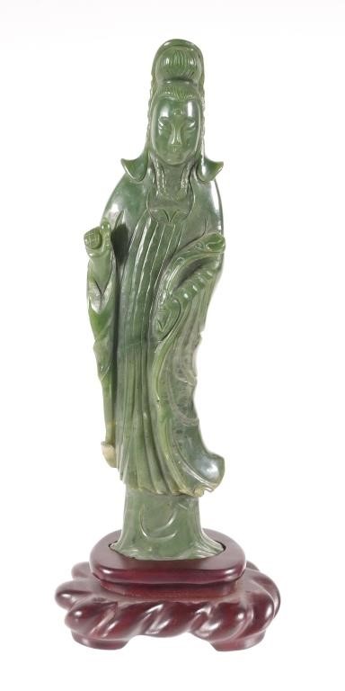 Appraisal: Carved jade figure of a Guanyin on wooden base with