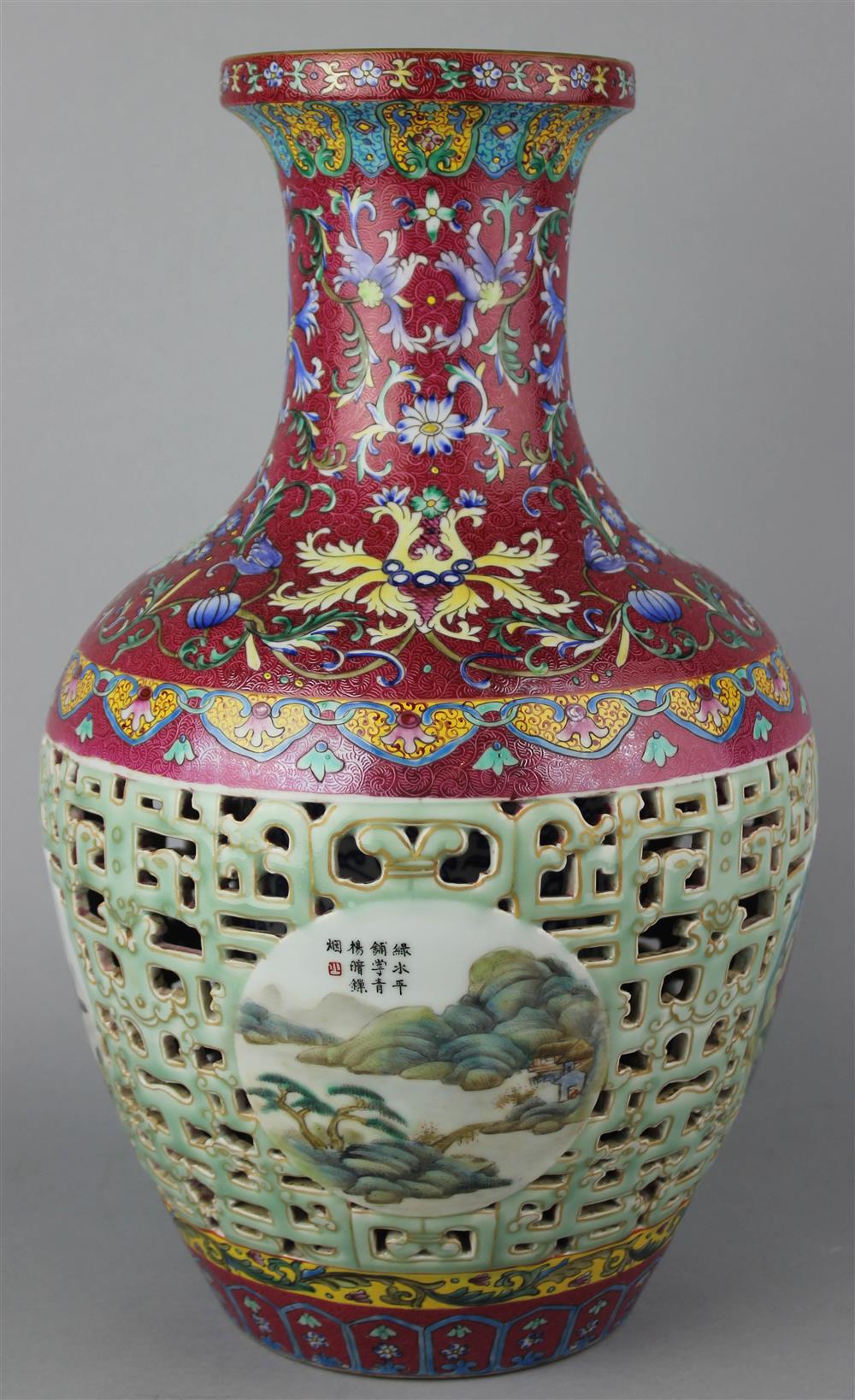 Appraisal: CHINESE RETICULATED FAMILLE ROSE VASE BEARING QIANLONG SIX-CHARACTER SEAL MARK