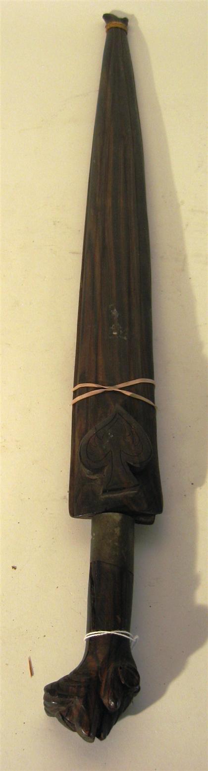 Appraisal: Kris blade with carved wood handles and scabbardL in