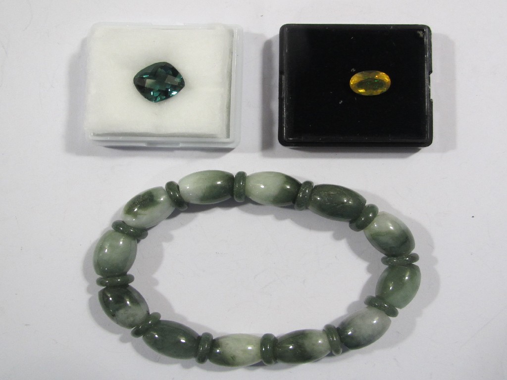 Appraisal: Lot comprising a jade bracelet an unmounted green tourmaline carats