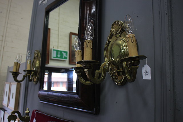 Appraisal: A PAIR OF GILT BRASS THREE BRANCH WALL LIGHTS with