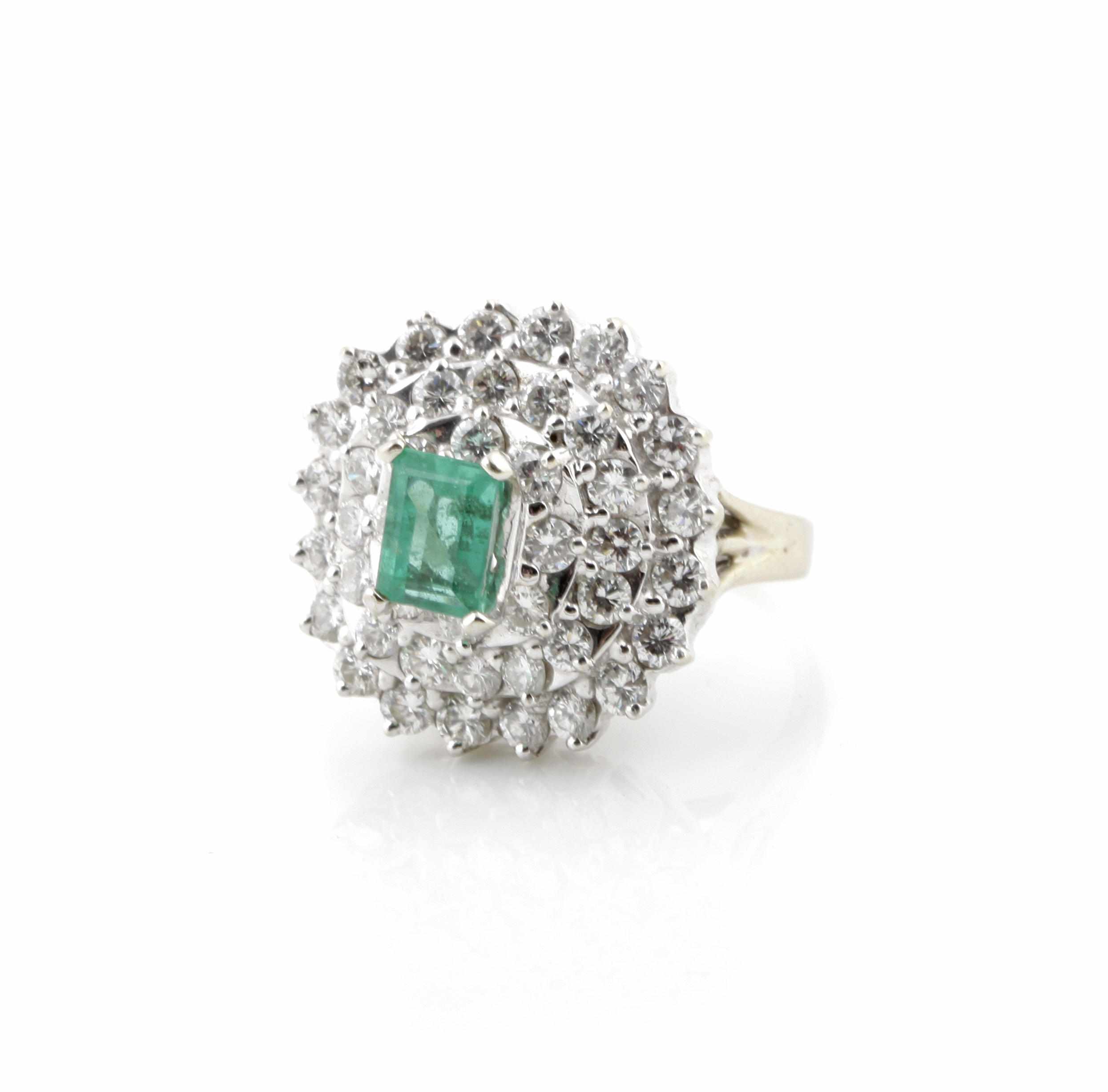 Appraisal: An emerald and diamond ring estimated total diamond weight cts