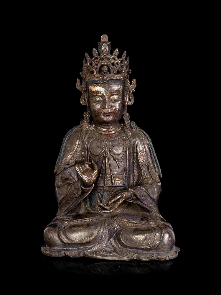 Appraisal: A Chinese Bronze Guanyin A Chinese Bronze Guanyin cast seated