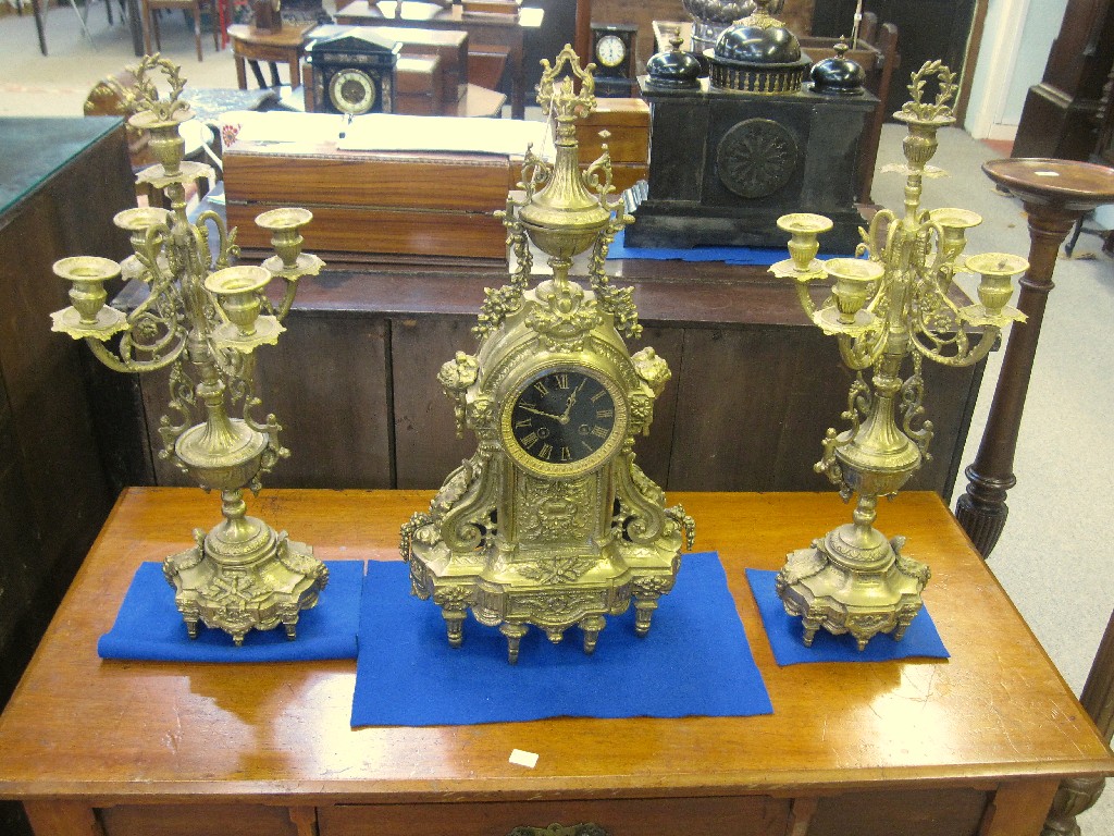 Appraisal: Reproduction gilt metal clock garniture pendulum in office