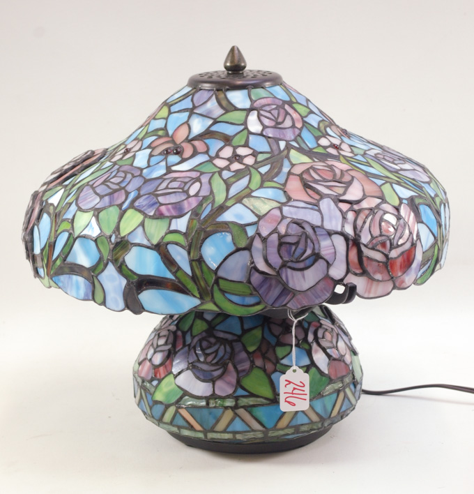 Appraisal: A TIFFANY INSPIRED STAINED GLASS TABLE LAMP squat form with