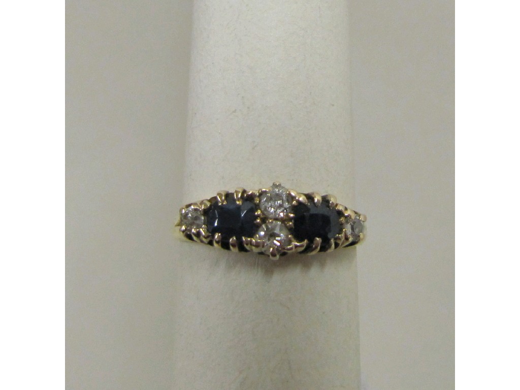 Appraisal: Eighteen carat gold sapphire and diamond set dress ring