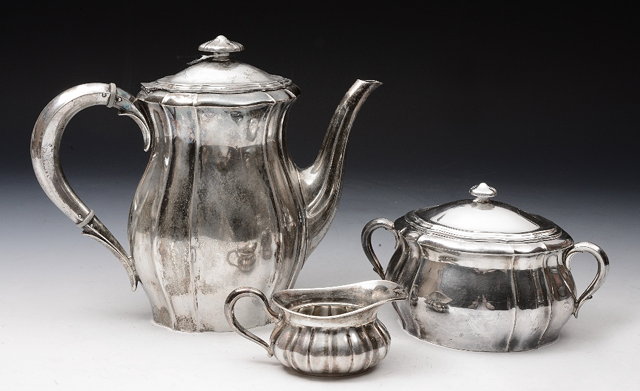 Appraisal: A GERMAN THREE PIECE COFFEE SERVICE comprising coffee pot twin