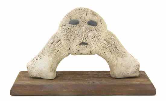 Appraisal: A Whale Bone and Agate Sculpture depicting a stylized figure