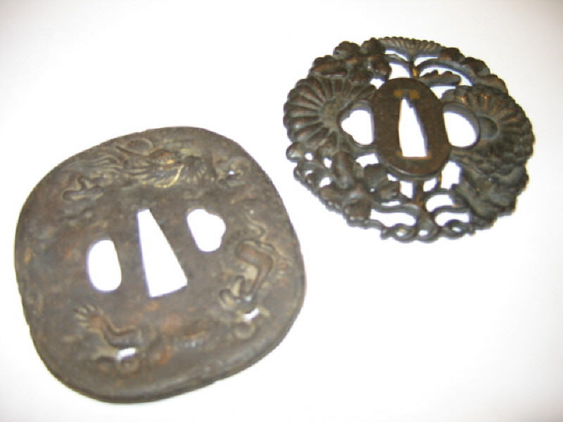 Appraisal: TWO ANTIQUE JAPANESE CAST METAL TSUBA One in iron of