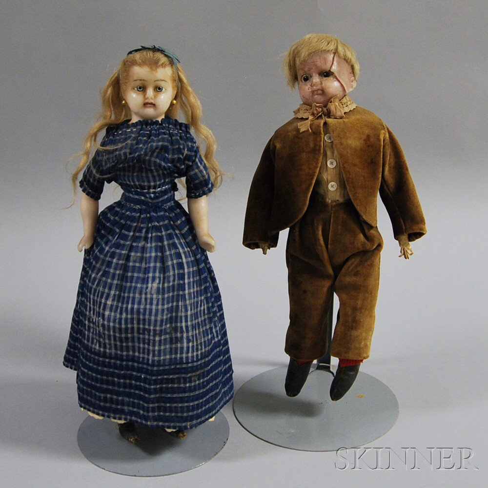 Appraisal: Two Wax Dolls a wax-over-composition boy doll with blond wig