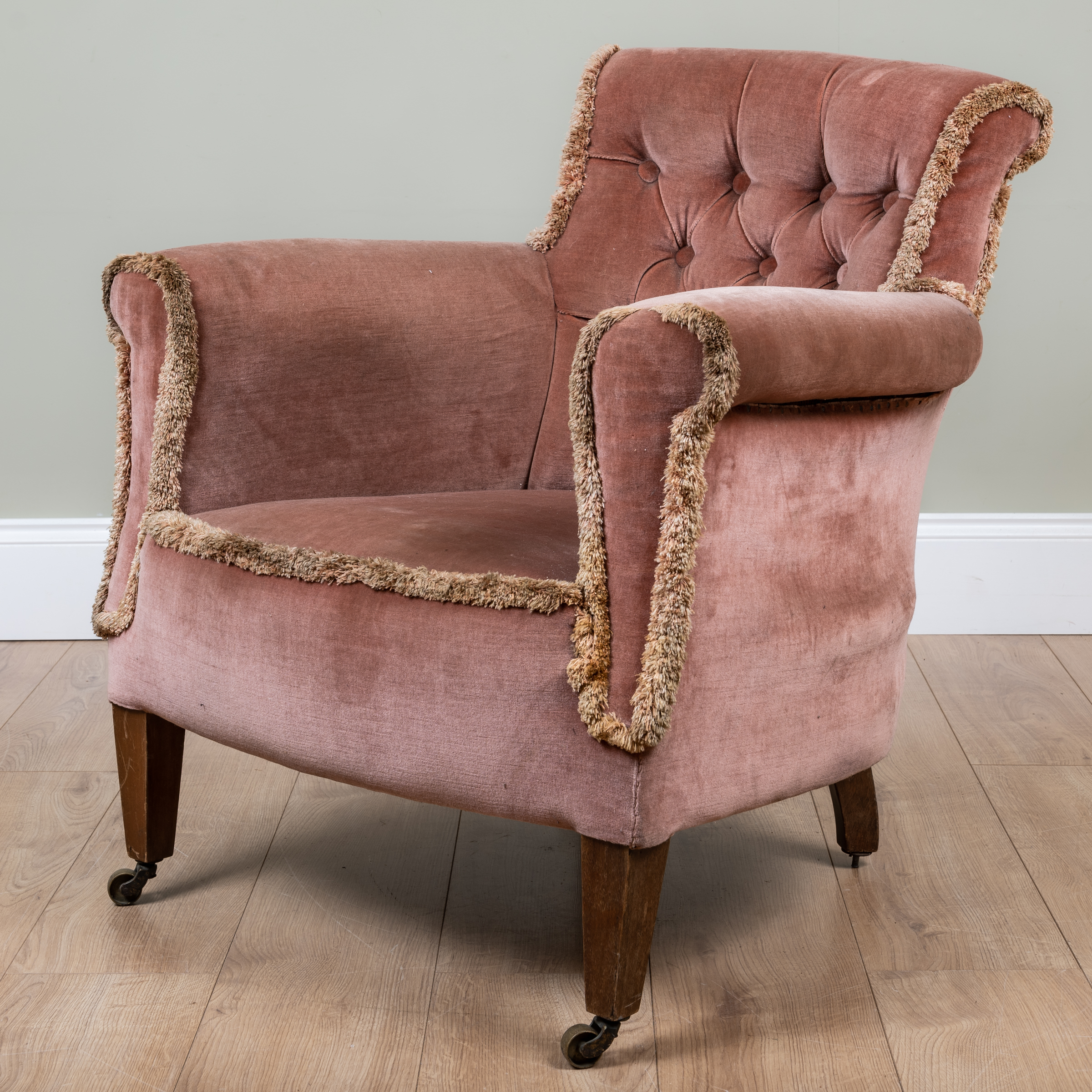 Appraisal: A pink Draylon upholstered button back armchair on square tapering