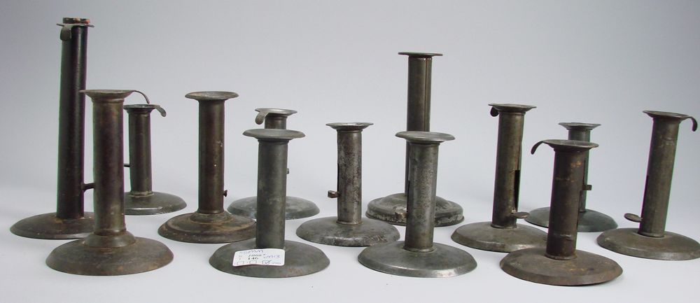 Appraisal: THIRTEEN TIN HOGSCRAPER CANDLESTICKS th CenturyAs is Heights from to