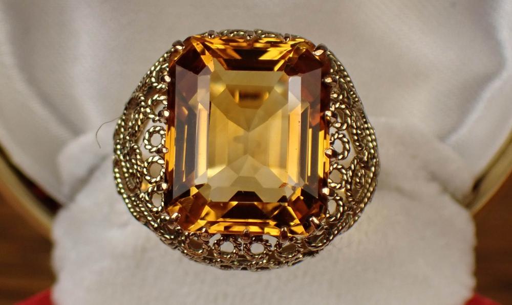 Appraisal: CITRINE AND FOURTEEN KARAT GOLD RING set with a single