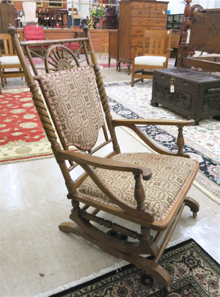 Appraisal: A CARVED AND UPHOLSTERED OAK PLATFORM ROCKER American c