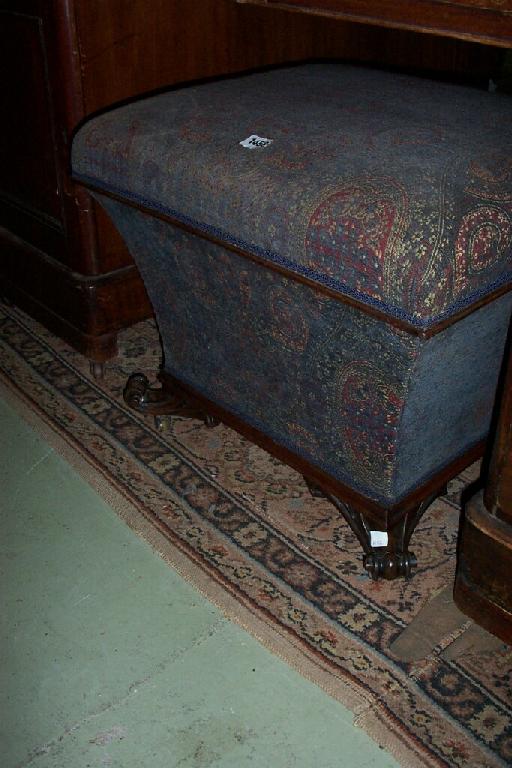 Appraisal: A Victorian mahogany upholstered ottoman with rising lid mahogany frame