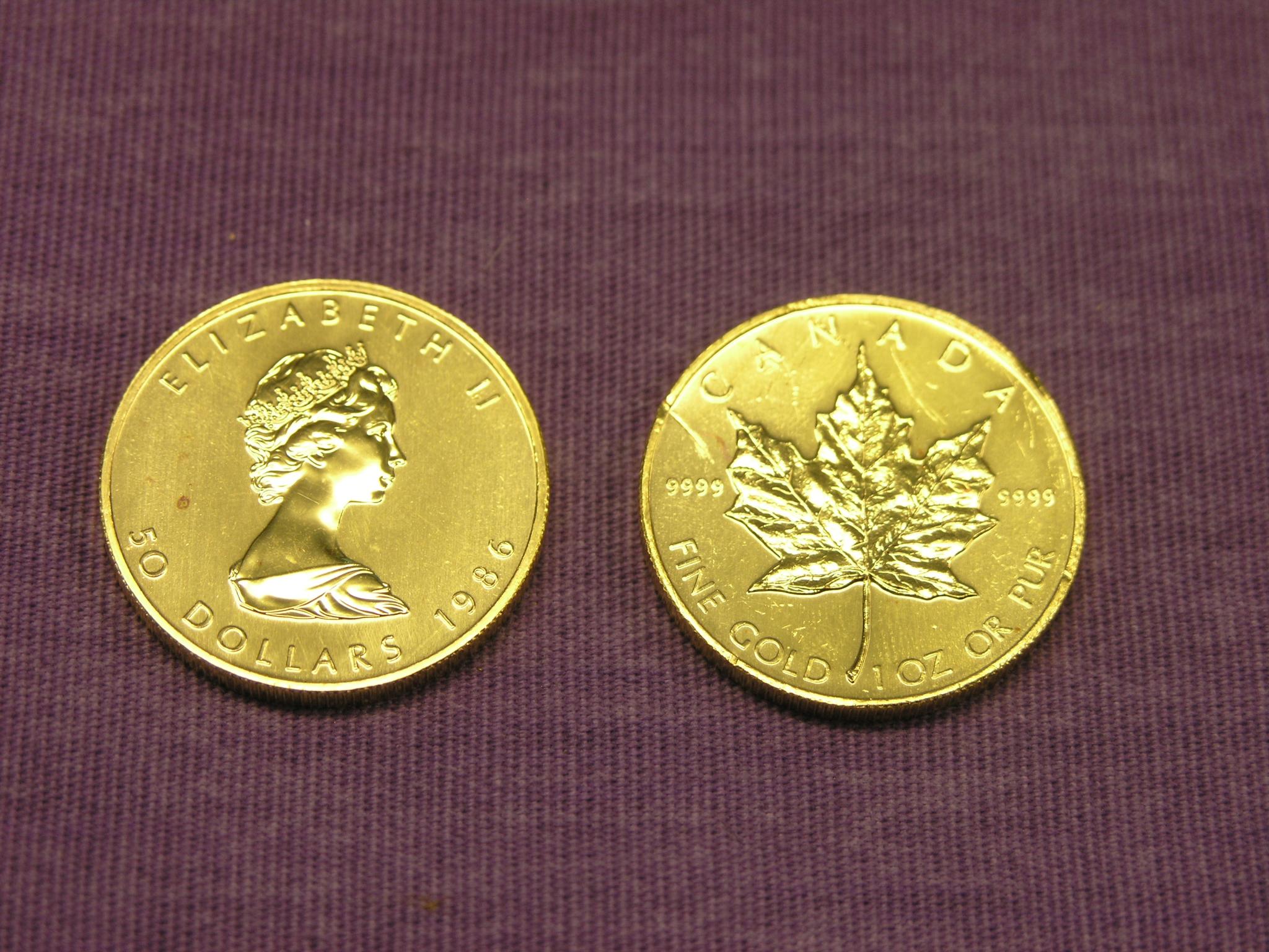 Appraisal: Two Canadian Dollars gold coins both one coin small scratch