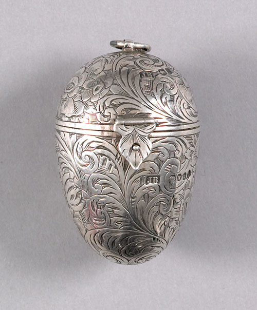 Appraisal: English silver egg form needle and thread case - bearing