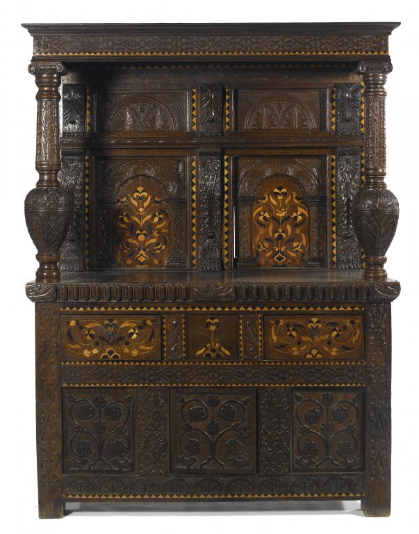 Appraisal: AN ENGLISH CARVED AND INLAID OAK BUFFET the strapwork cornice