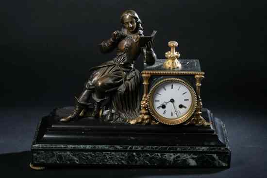 Appraisal: BLACK ONYX AND GILT METAL FIGURAL MANTLE CLOCK late th