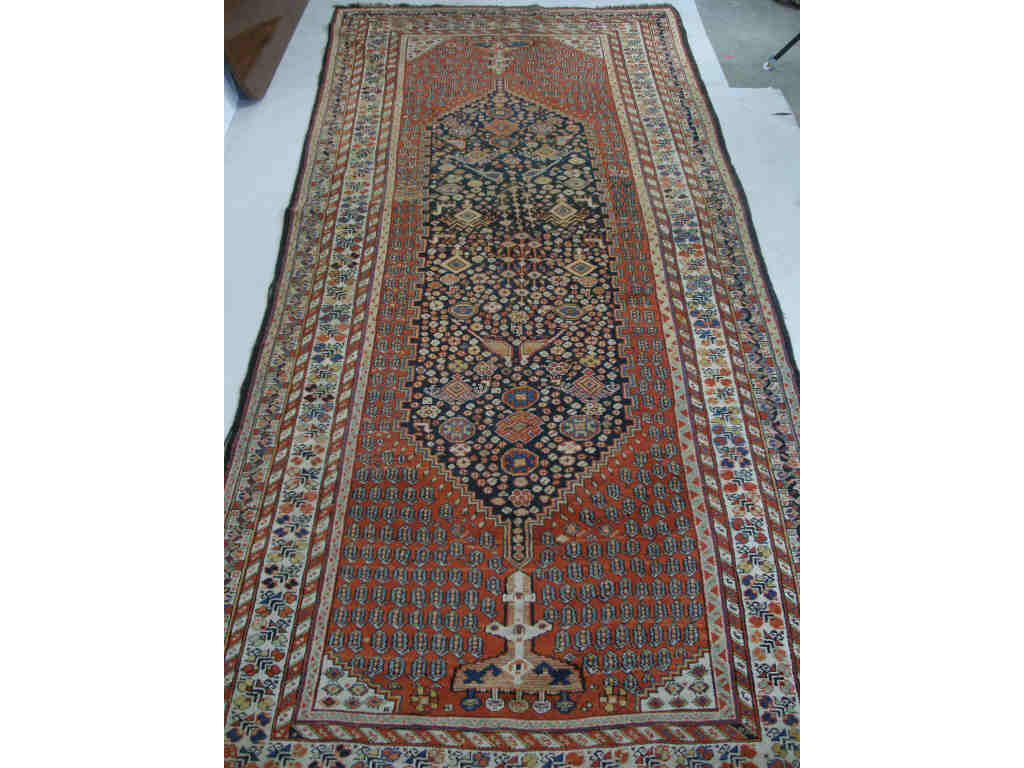 Appraisal: Antique Persian Long Rug Large central geometric medallion of rosettesand