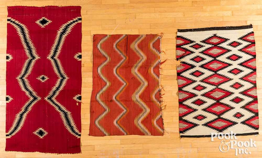 Appraisal: Three Navajo Indian rugs Three Navajo Indian rugs with serrated