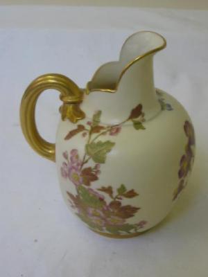 Appraisal: A ROYAL WORCESTER IVORY PORCELAIN JUG of flat back form