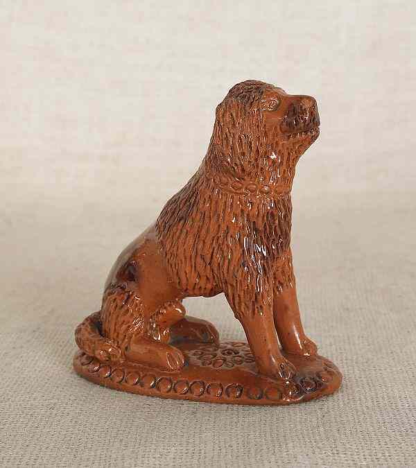 Appraisal: Pennsylvania redware seated dog th c h