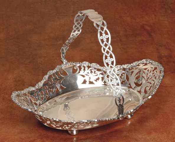 Appraisal: AN EDWARDIAN SILVER BASKET oval with shaped pierced sides with