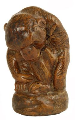 Appraisal: A leather covered model of a seated monkey the base