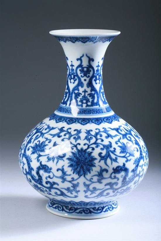 Appraisal: CHINESE BLUE AND WHITE PORCELAIN VASE Scrolling foliage and floral