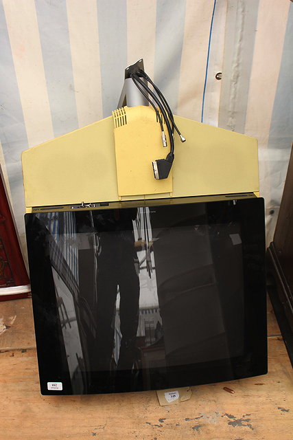 Appraisal: A BANG OLUFSEN YELLOW TELEVISION with wall mounting bracket cm