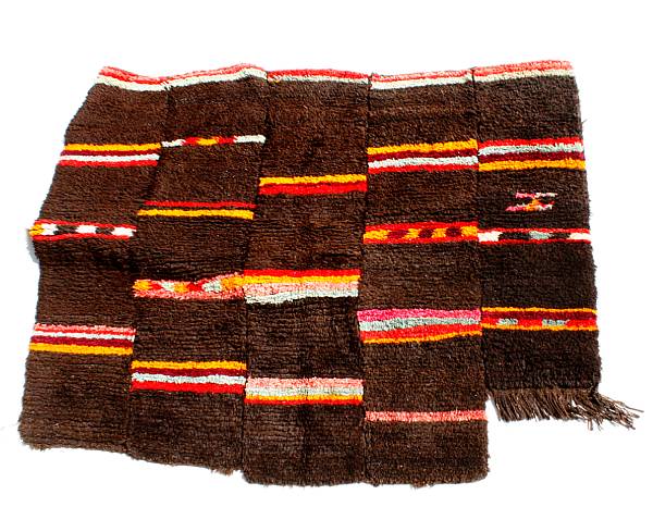 Appraisal: Two tribal shag rugs dimensions of the larger rug approximately