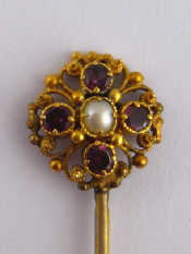 Appraisal: A garnet and seed pearl stick pin approx cm gr