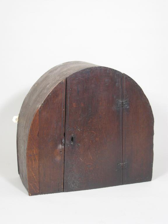 Appraisal: An early th Century oak Boarded Mural Cupboard with arched