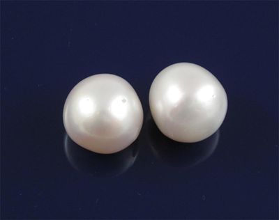 Appraisal: Two slightly pear shaped south sea cultured pearls One pearl