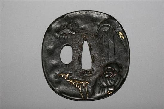 Appraisal: JAPANESE METAL TSUBA Edo period Motif of man shakudo head