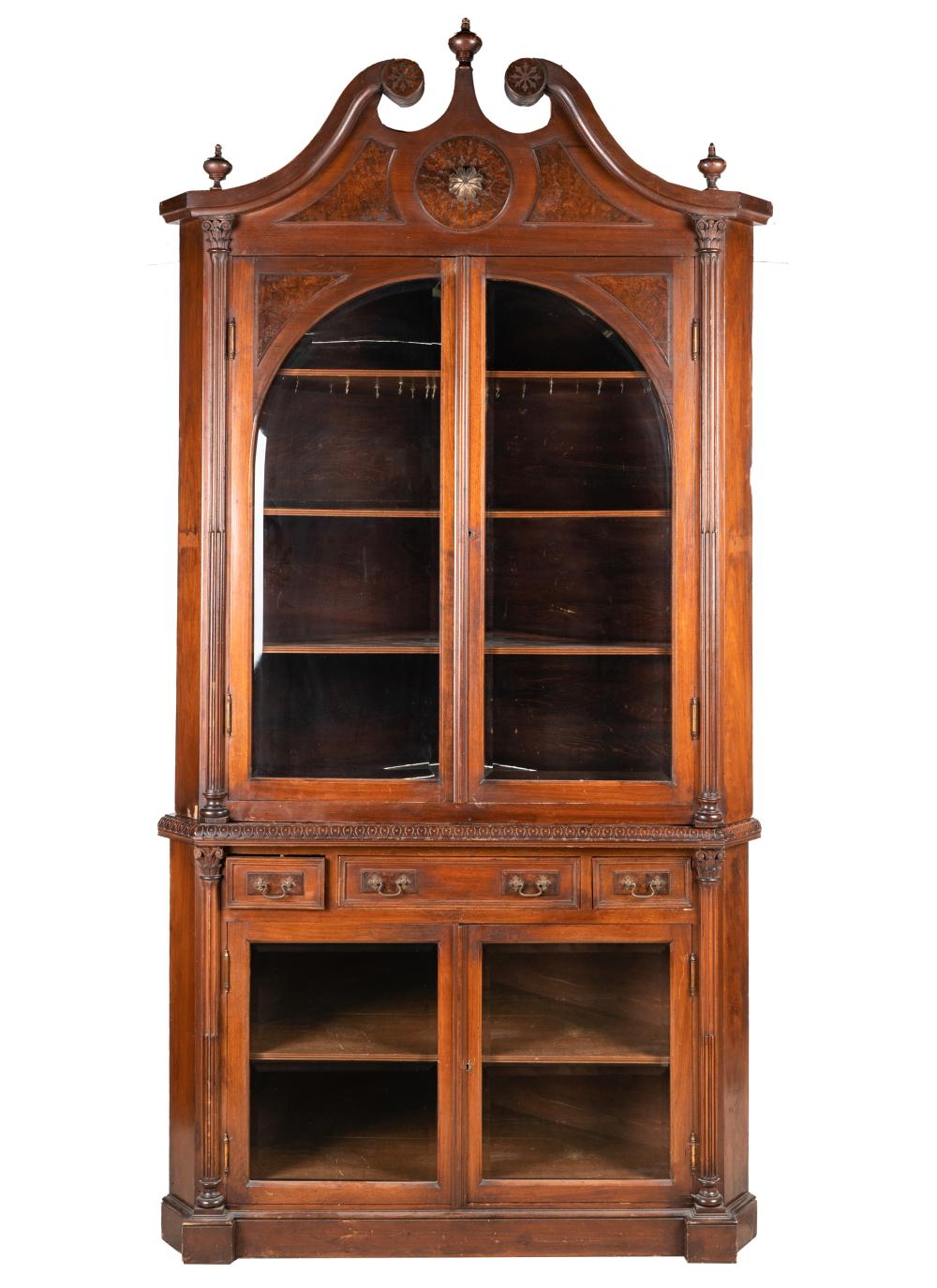 Appraisal: CARVED MAHOGANY CORNER CABINET th century constructed in two sections