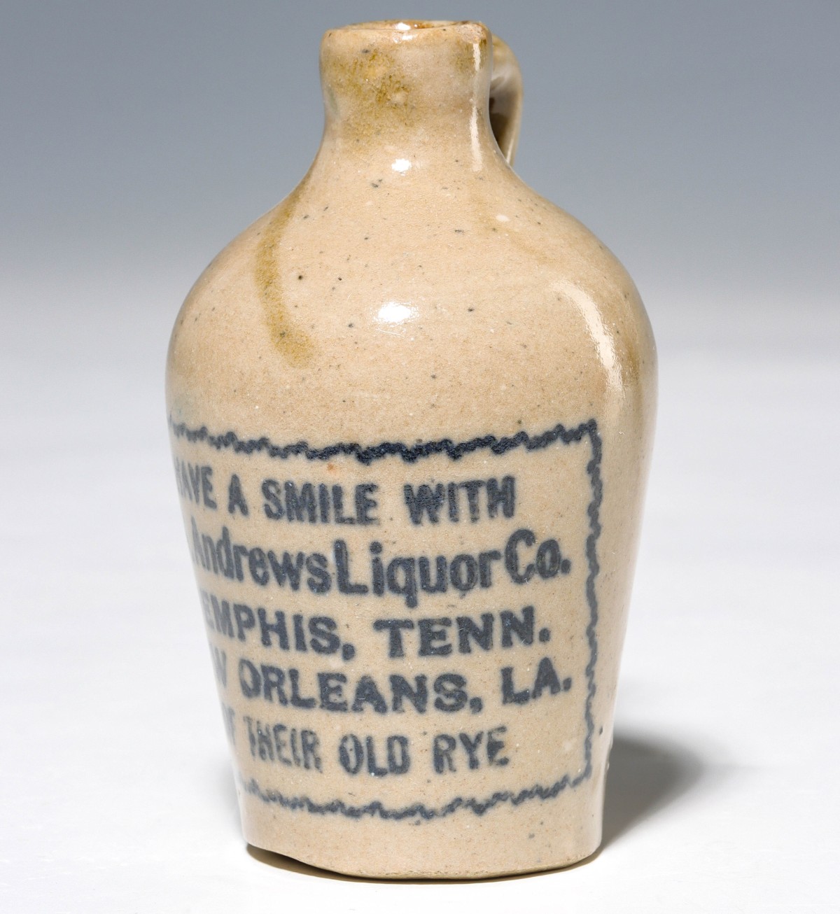 Appraisal: NEW ORLEANS AND MEMPHIS LIQUOR STONEWARE MINI JUG