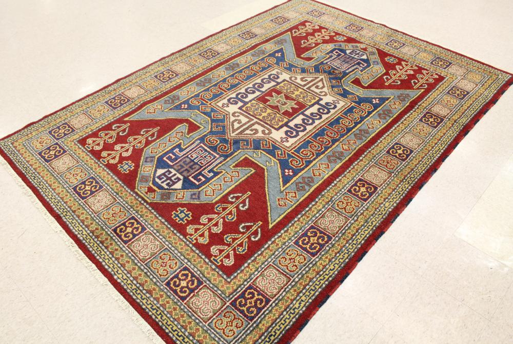 Appraisal: HAND KNOTTED ORIENTAL CARPET Indo-Persian geometric and curvilinear tribal design