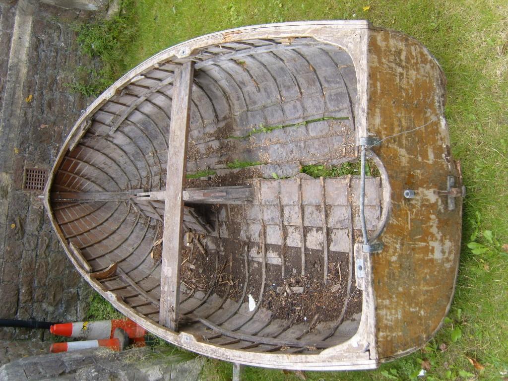 Appraisal: A timber framed clinker built sailing dingy with applied label