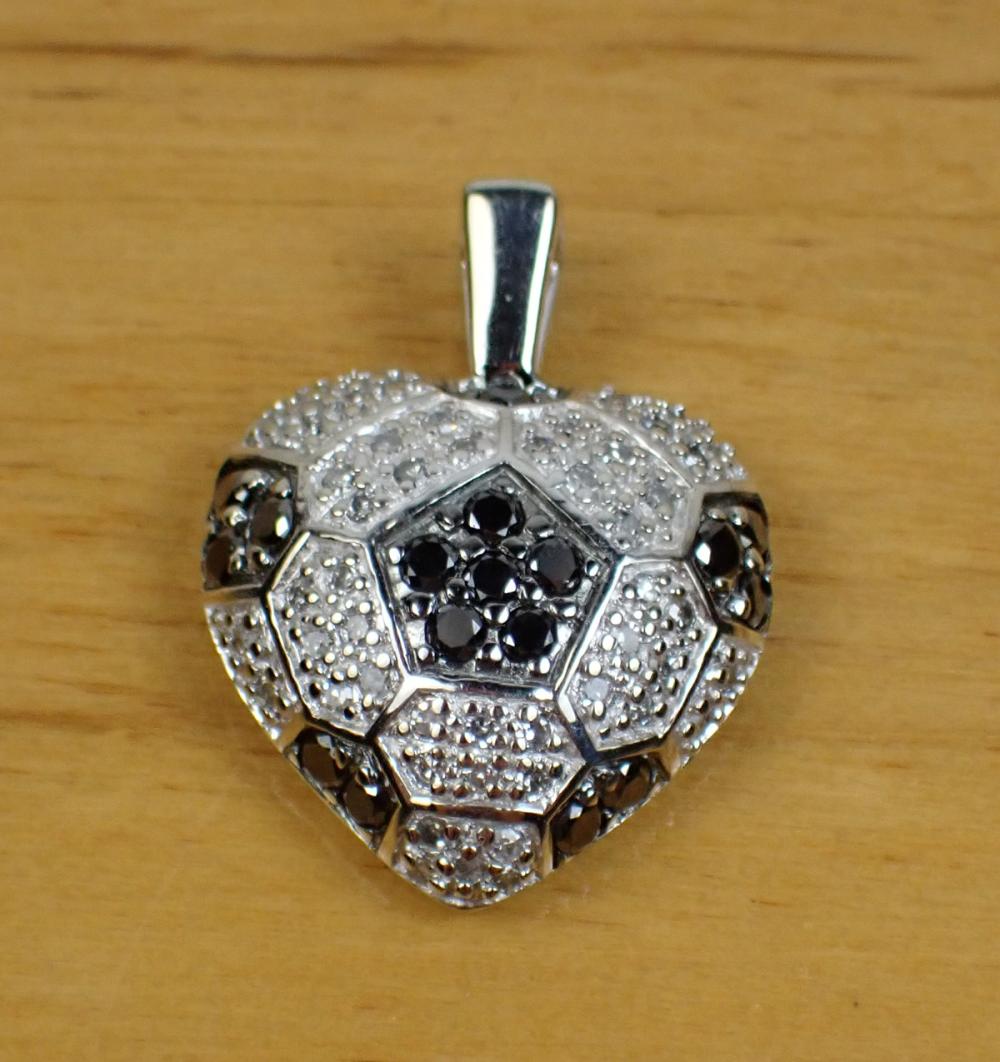 Appraisal: BLACK AND WHITE DIAMOND AND WHITE GOLD PENDANT The k